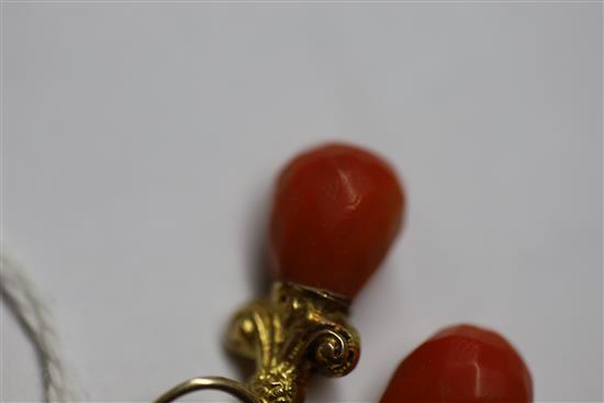 A pair of yellow metal and coral drop earrings and a similar pair of ear clips